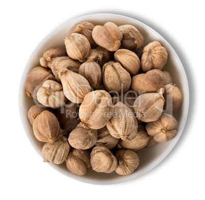 Black cardamom in plate isolated