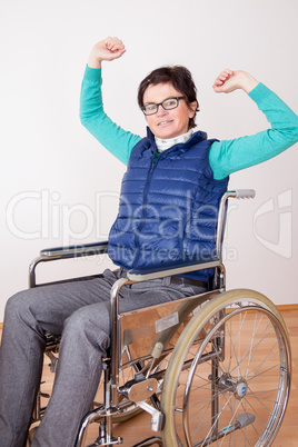 Woman in wheelchair with stretching exercises