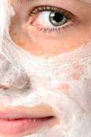 Smiling girl moisturizer facial face mask eye