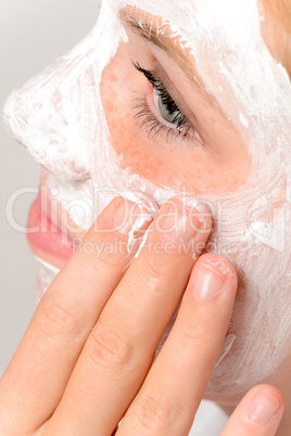 Applying mask fingers young girl beauty skin
