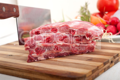 chopping fresh pork ribs and vegetables