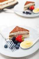 tiramisu dessert with berries and cream