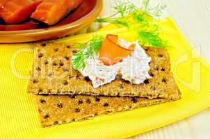 Bread with mayonnaise and salmon on board