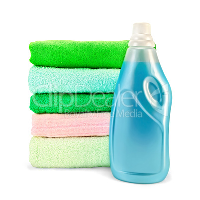 Fabric softener the bottle and a stack of towels
