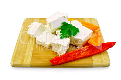 Feta cheese pieces with colored peppers