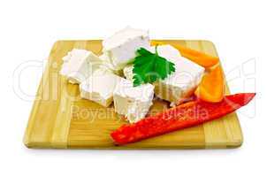 Feta cheese pieces with colored peppers