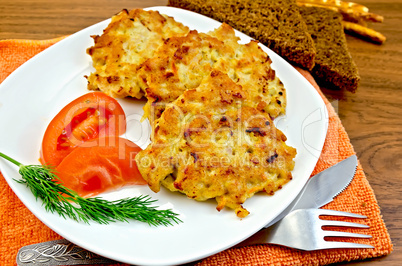 Fritters chicken with vegetables and bread on a board
