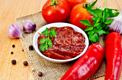 Ketchup with vegetables on a napkin burlap