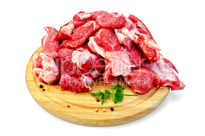 Meat cut into slices on a round board