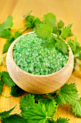 salt green in a bowl with nettles on the board