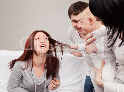 The little brother has seized hair to sister