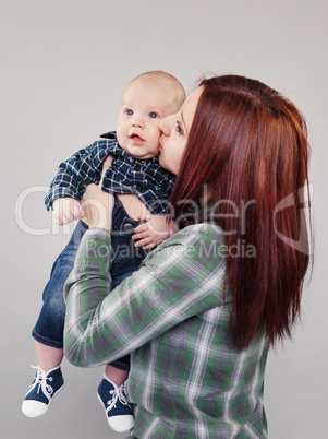 The girl the teenager kisses the baby