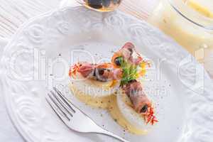 eggs with ham and black olive ones