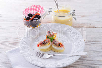 eggs with ham and black olive ones