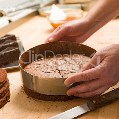 Cook taking out cake from cake form