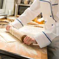 Cook rolling dough kitchen with rolling pin