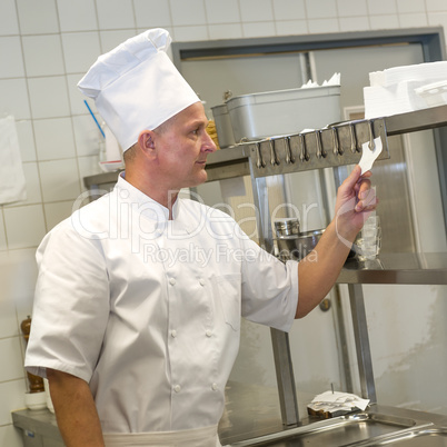 Chef reading orders in restaurant's kitchen