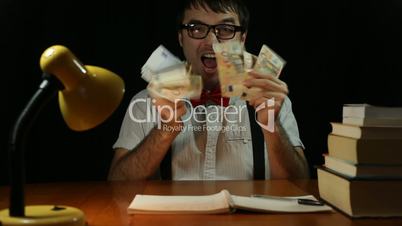 Funny ecstatic rich nerd man with money