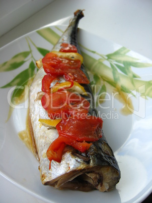 dish with mackerel of cold smoking and pieces of lemon