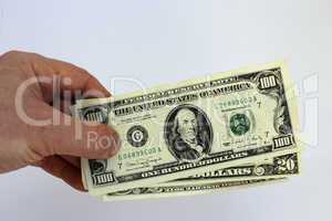 hand holding us dollars isolated on a white background