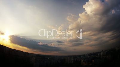 Dramatic multi-colored sky over the city. Timelapse