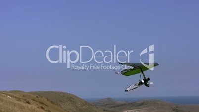 Hangglider in the blue sky