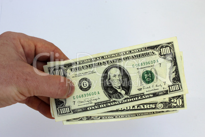 hand holding us dollars on a white background