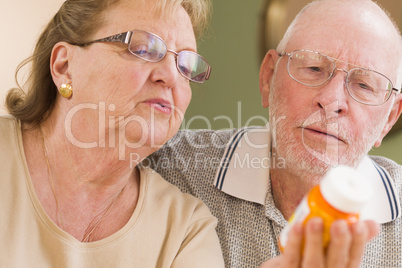 Senior Couple Reading Medicine Bottle