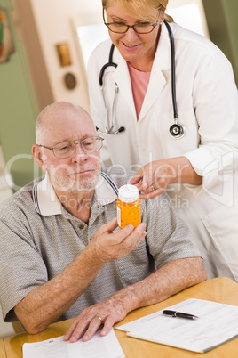 Doctor or Nurse Explaining Prescription Medicine to Senior Man