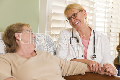 Doctor or Nurse Talking to Sitting Senior Woman Doctor or Nurse Talking to Sitting Senior Woman