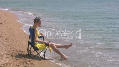 Beach, yellow dress, blue chair