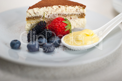 tiramisu dessert with berries and cream