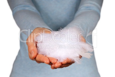 hands holding feathers