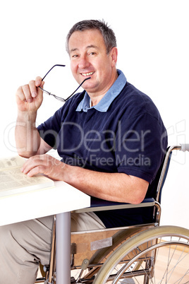 Man sitting in a wheelchair at the table