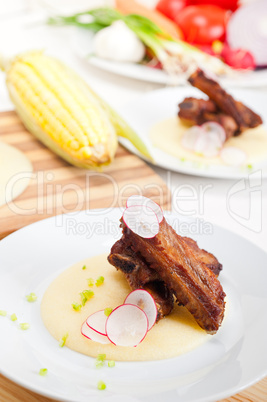 pork ribs on polenta corn cream bed