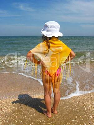 girl standing at the seacoast