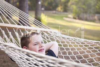 Young Boy Enjoying A Day in His Hammock
