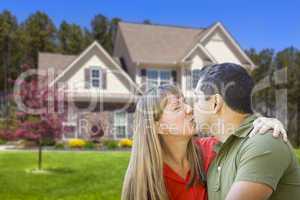 Mixed Race Couple Hugging in Front of House