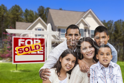 Hispanic Family in Front of Sold Real Estate Sign, House