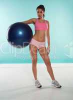 woman holding a gym ball