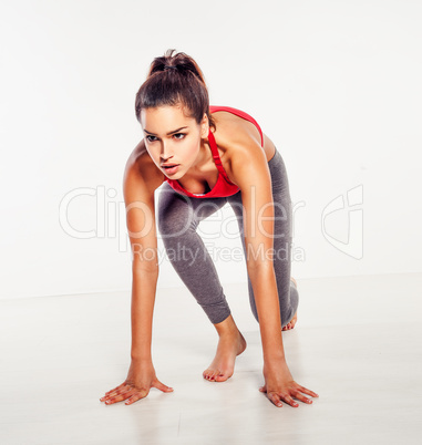 athletic woman in starter position
