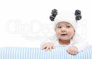 happy baby in knitted hat