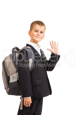 Schoolboy sitting on books