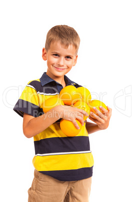 Boy holding oranges