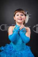 Portrait of cute smiling little girl in princess dress