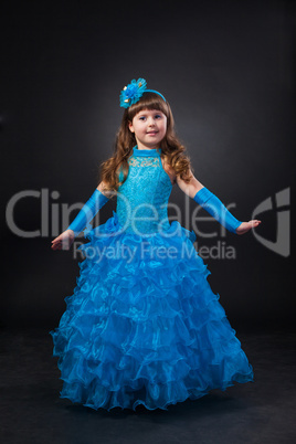 Portrait of cute smiling little girl in princess dress