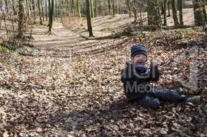 young boy in forest