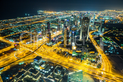 Dubai downtown night scene with city lights,