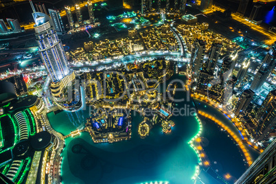 Dubai downtown night scene with city lights,