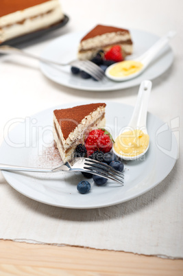 tiramisu dessert with berries and cream